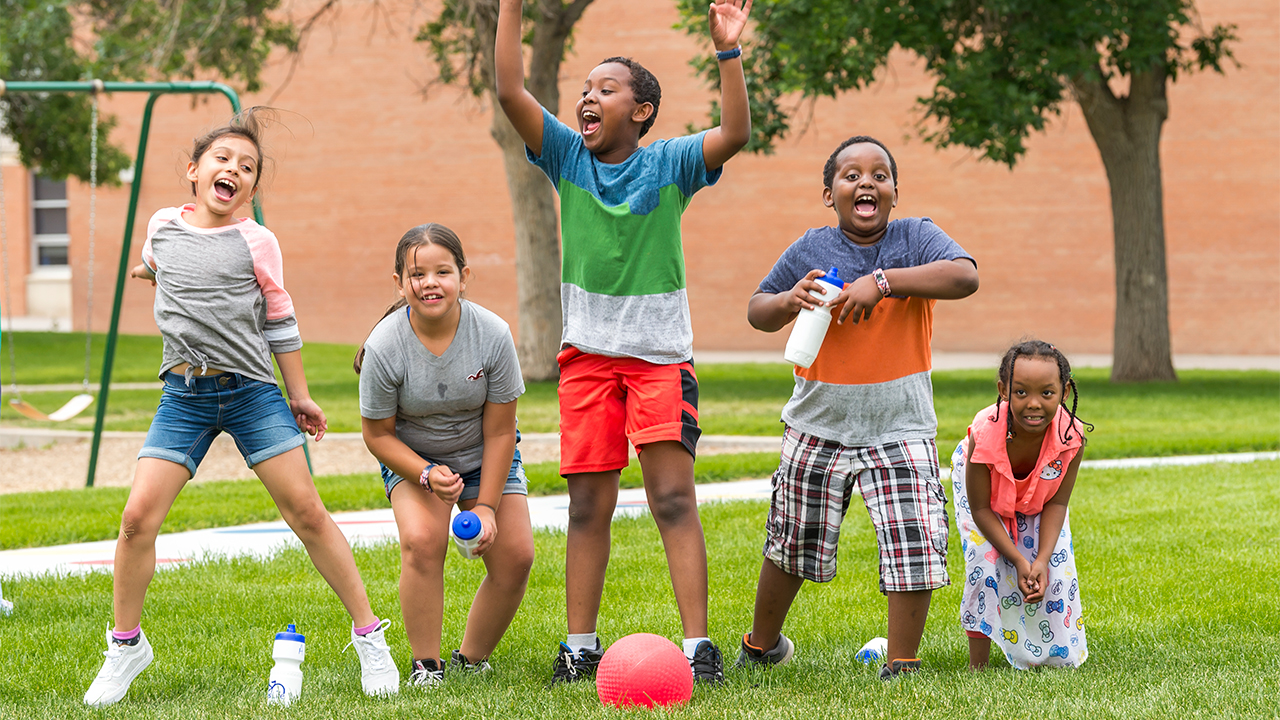 Five kids playing in a park
